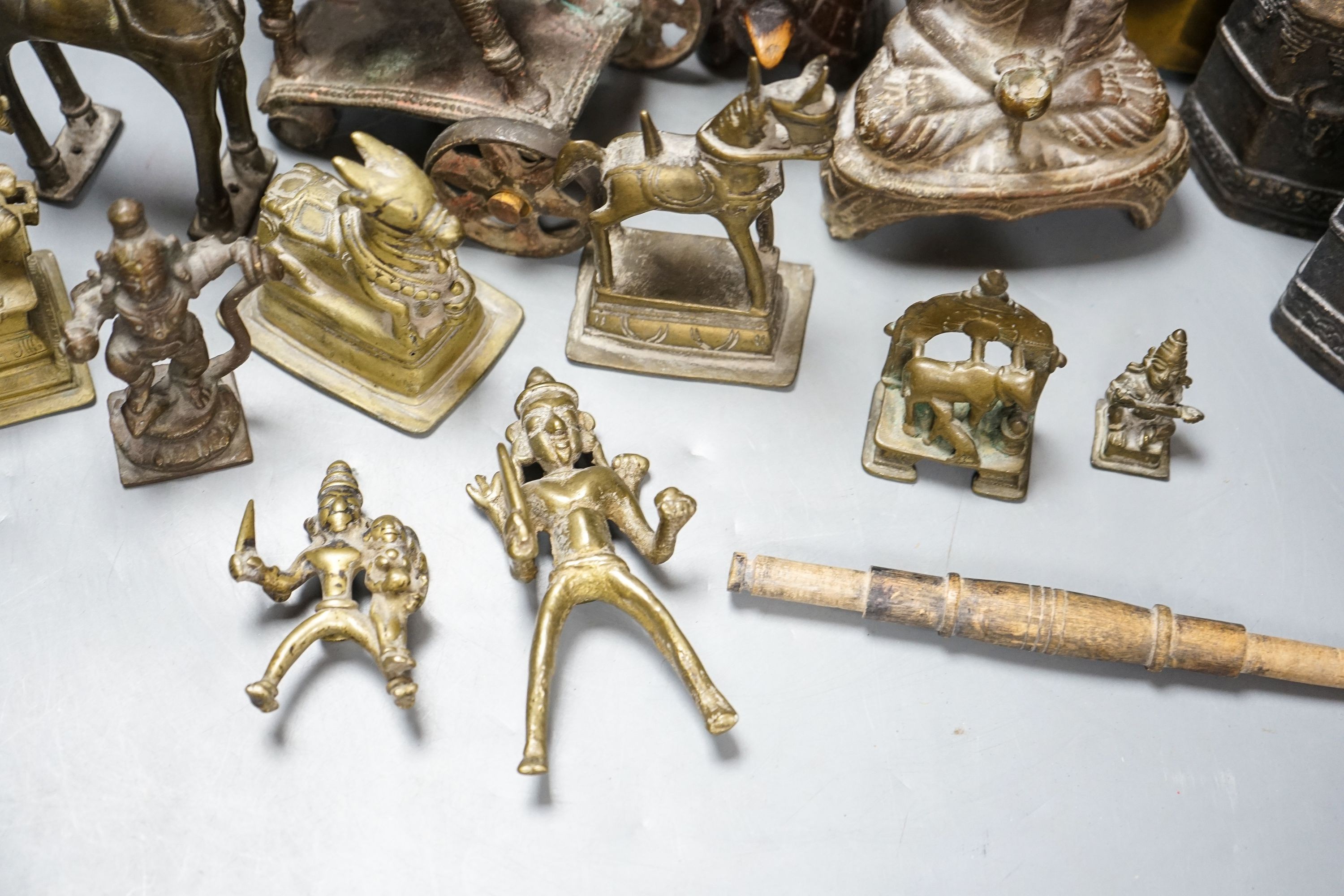 A group of Indian brass and wood figures and a Chinese wood figure
